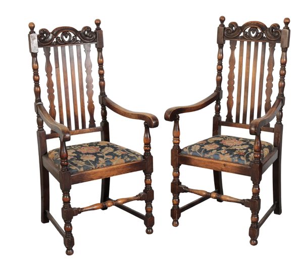 A PAIR OF 'JACOBETHAN'  STYLE OAK ARMCHAIRS