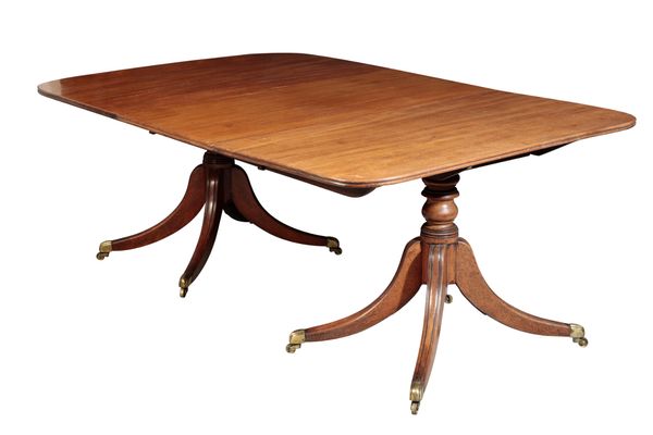 A REGENCY STYLE MAHOGANY TWIN-PEDESTAL DINING TABLE