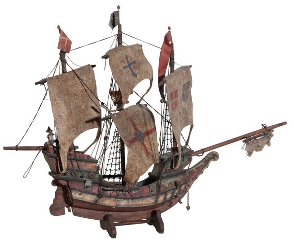 A CARVED AND PAINTED WOODEN MODEL OF A GALLEON