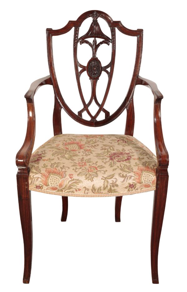 A GEORGE III STYLE MAHOGANY ELBOW CHAIR IN THE MANNER OF GEORGE HEPPLEWHITE