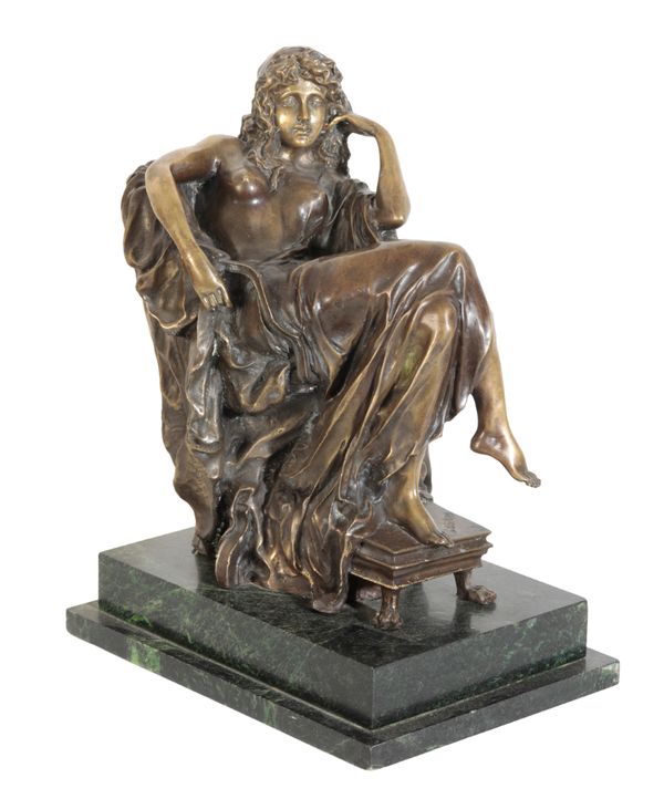 A BRONZE FIGURE OF A SEATED LADY