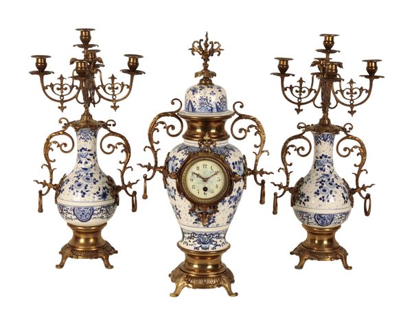 A 20TH CENTURY FRENCH PORCELAINE AND GILT METAL CLOCK GARNITURE