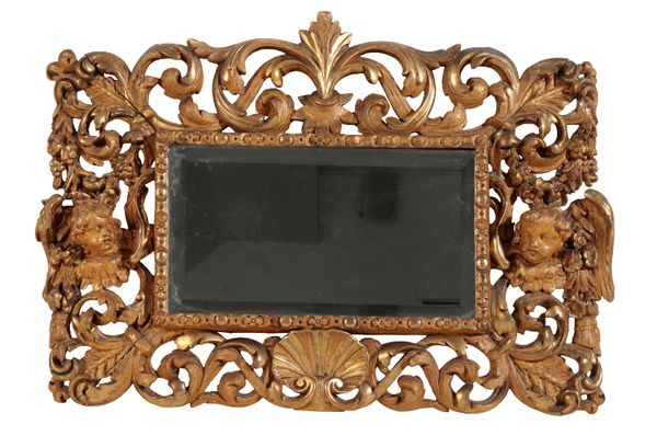 A CARVED GILTWOOD BAROQUE STYLE MIRROR