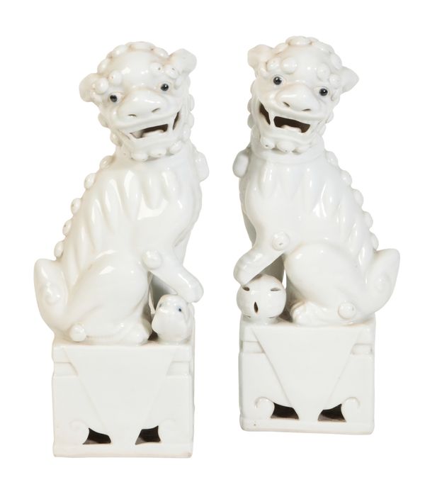 A PAIR OF CHINESE BLANC DE CHINE DOGS OF FO