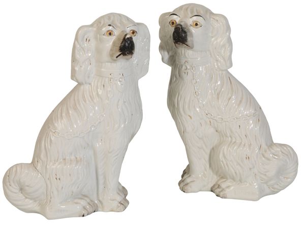 A PAIR OF LARGE VICTORIAN STAFFORDSHIRE POTTERY DOGS