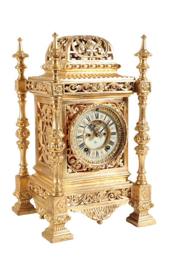 A GILT BRASS CASED MANTLE CLOCK