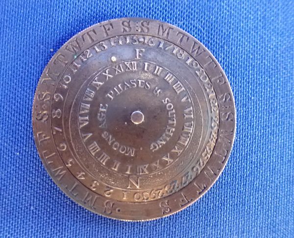 A GEORGE III BRASS POCKET PERPETUAL CALENDAR