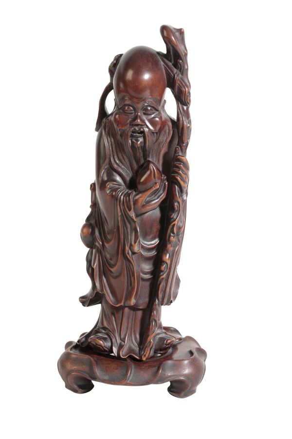 A CHINESE CARVED HARDWOOD FIGURE