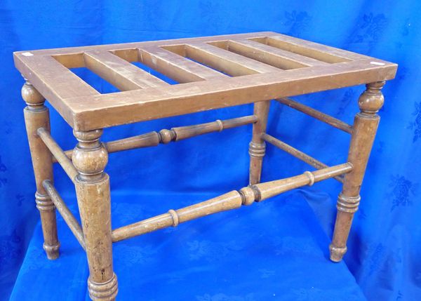 A VICTORIAN BEECH LUGGAGE STAND, ON  TURNED LEGS