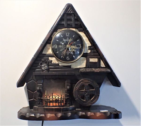 A 1960S KITSCH CHALET STYLE CLOCK WITH 'PRESIDENT' ELECTRIC MOVEMENT