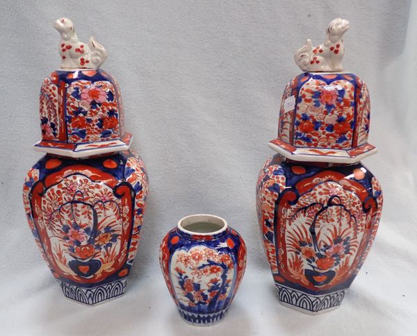 PAIR OF IMARI DECORATED JARS AND COVERS