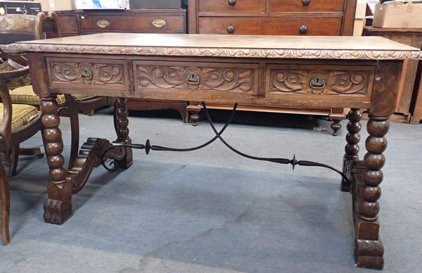 A STAINED BEECH CENTRE TABLE, IN THE SPANISH STYLE