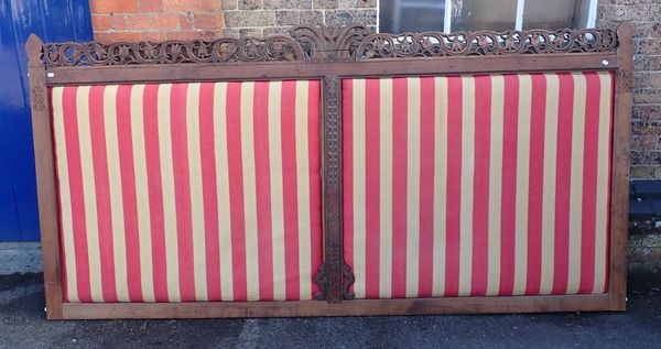 AN INDIAN CARVED WOOD FRAME BED HEAD