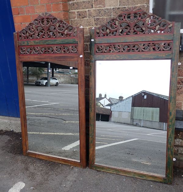 A PAIR OF SOUTH-EAST ASIAN CARVED WOOD AND POLYCHROME MIRRORS