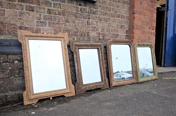 A SMALL FRENCH GILT FRAMED WALL MIRROR, WITH ROUNDED TOP CORNERS