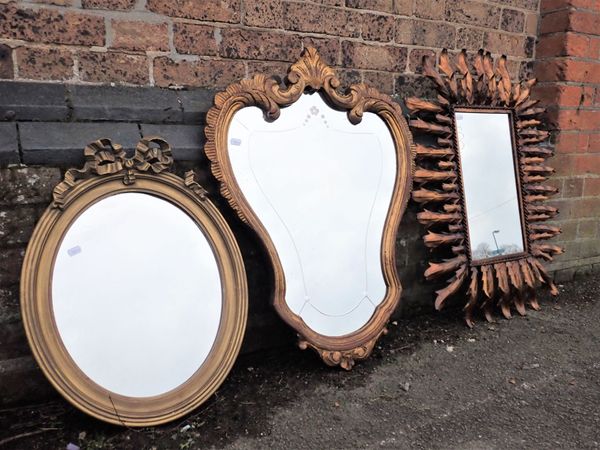 A CONTEMPORARY GILT-METAL FRAMED WALL MIRROR