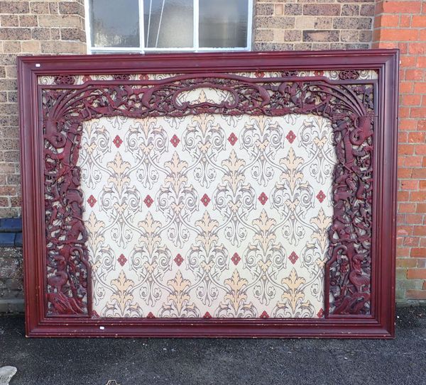 A CARVED AND PAINTED CHINESE FRAME PREVOUSLY USED AS A BEDHEAD