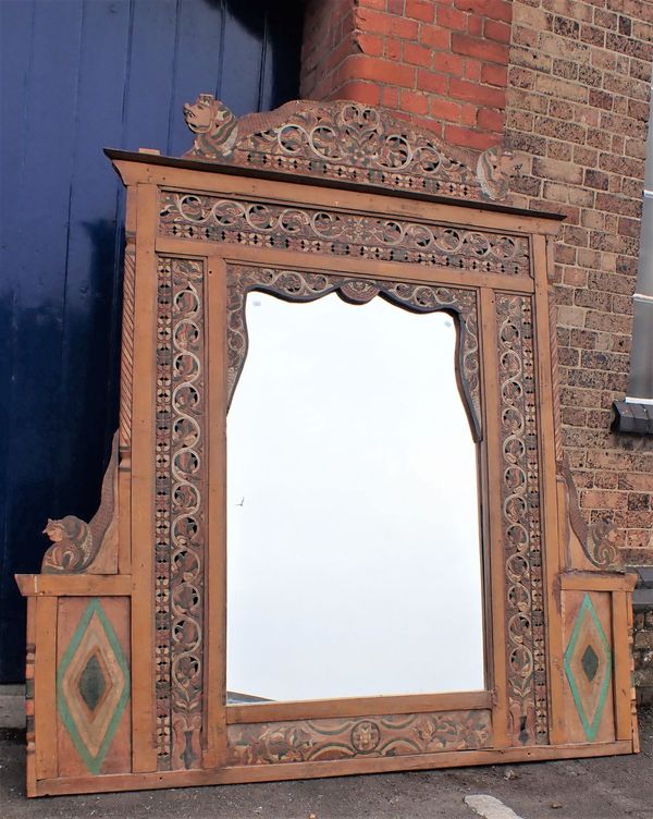 A LARGE ASIAN CARVED FRAME, WITH  BEASTS AND SCROLLING BORDERS