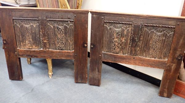 A PAIR OF OAK BED ENDS, WITH RE-USED LINENFOLD PANELS