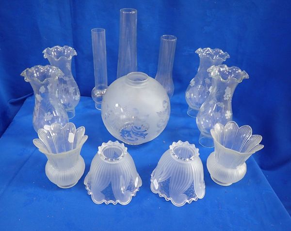 A COLLECTION OF GLASS SHADES,  OIL LAMP CHIMNEYS AND GLOBES