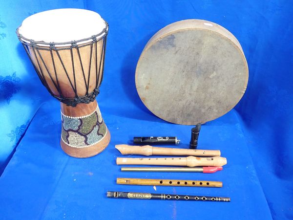 A TRIBAL DRUM AND OTHER INSTRUMENTS