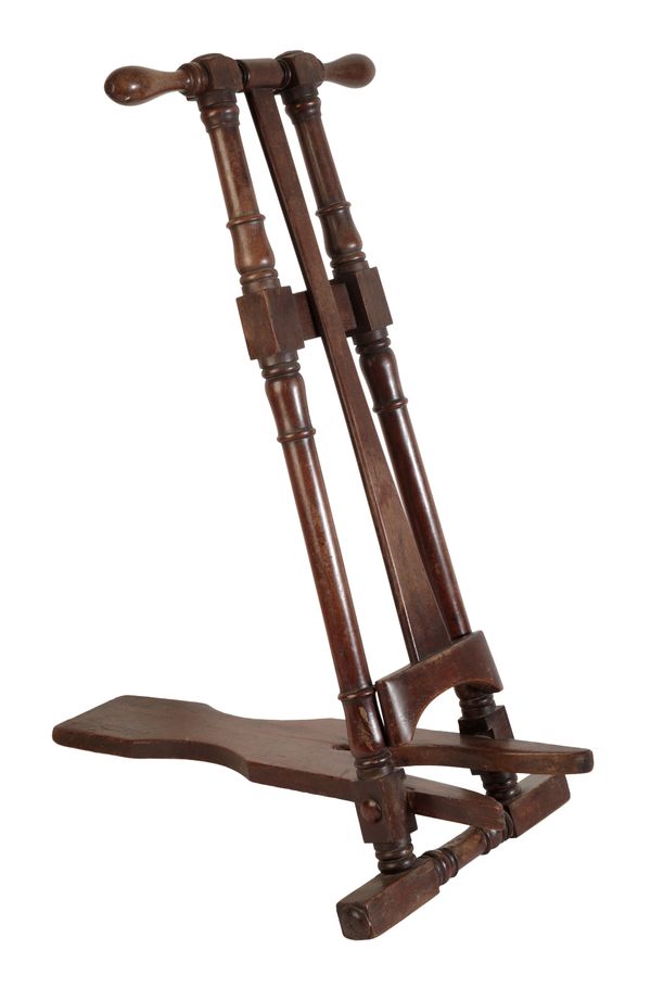 MAXWELL, LONDON: A MAHOGANY FREESTANDING BOOT JACK