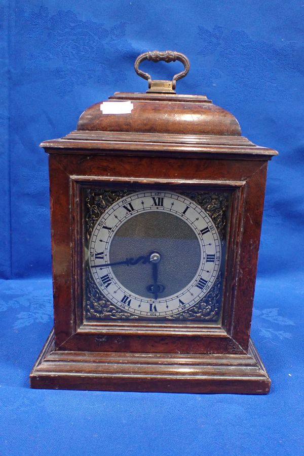 A GEORGE II STYLE WALNUT MANTEL CLOCK WITH CAST SPANDRELS