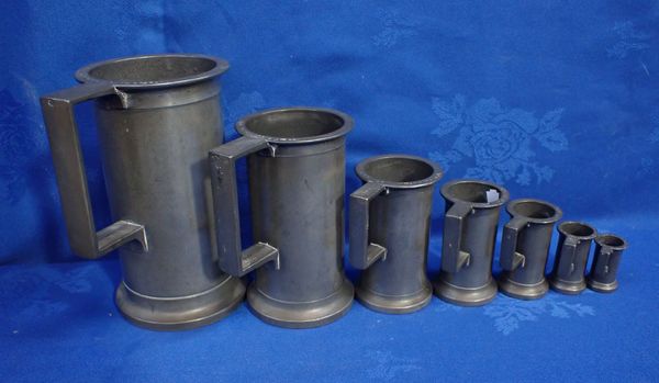 A SET OF SEVEN FRENCH METRIC PEWTER MEASURES