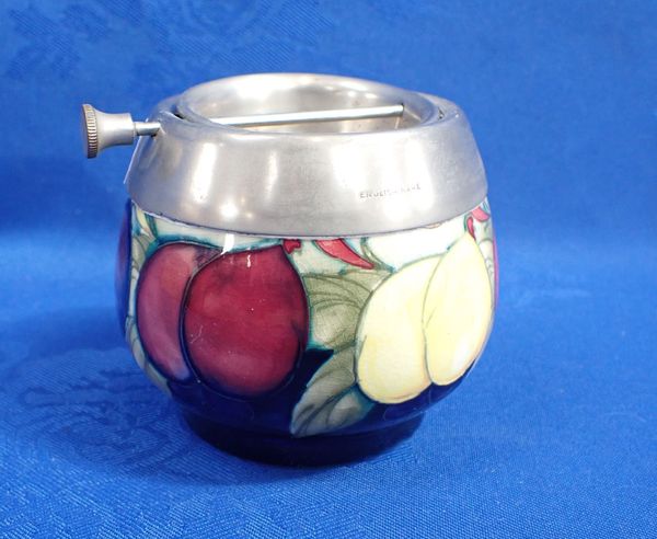 A MOORCROFT PLUM AND WISTERIA ASHTRAY