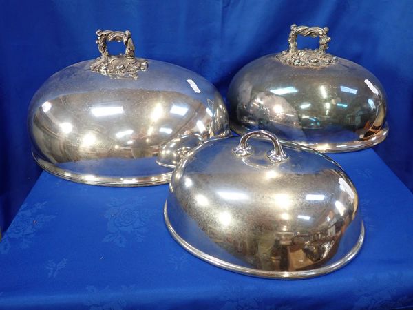 TWO MATCHING SILVER-PLATED DISH COVERS, WITH FOLIATE CAST HANDLES