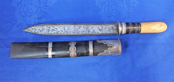 AN INDIAN DAGGER, WITH PROFUSELY ENGRAVED BLADE