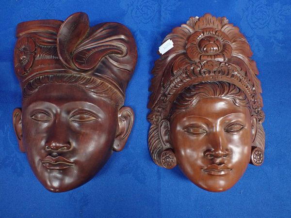 TWO INDONESIAN CARVED HARDWOOD HEADS