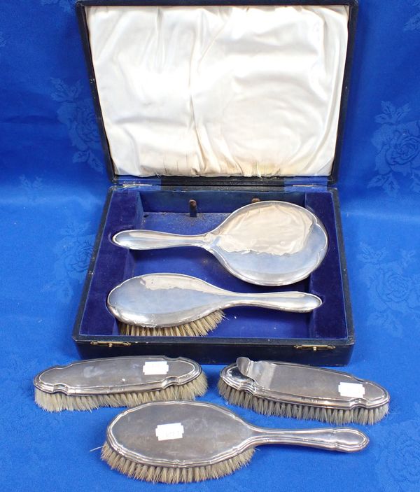 A SILVER BACKED BRUSH AND MIRROR