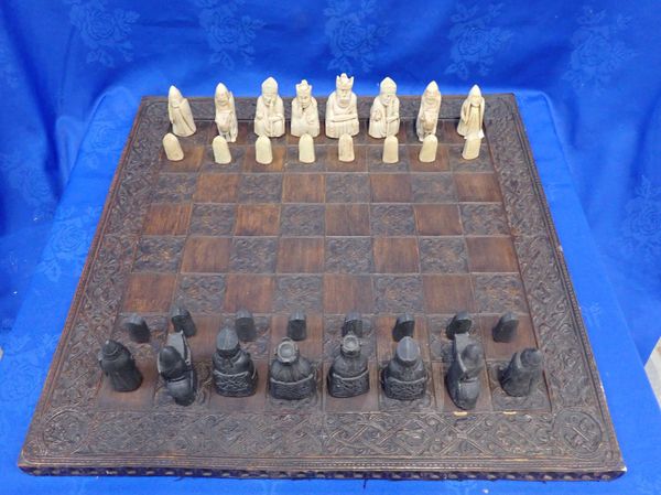 A 19th CENTURY CARVED OAK CHESS BOARD