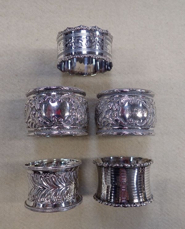 FIVE SILVER NAPKIN RINGS