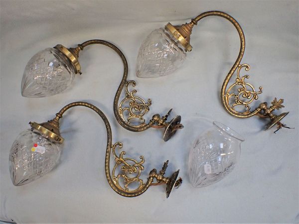 A SET OF THREE VICTORIAN GAS WALL LIGHTS, WITH  CUT-GLASS SHADES