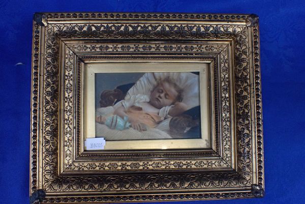 A VICTORIAN OVERPAINTED STUDY OF A SLEEPING BABY