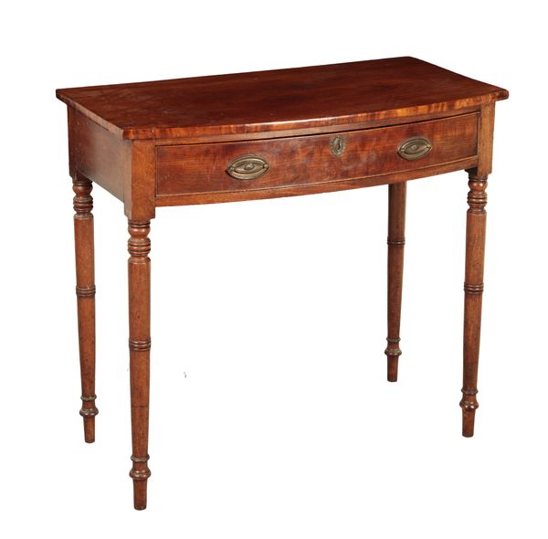 A REGENCY MAHOGANY BOW FRONT SIDE TABLE