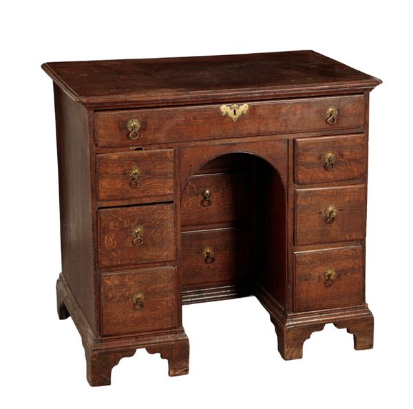 A GEORGE I OAK KNEEHOLE DESK