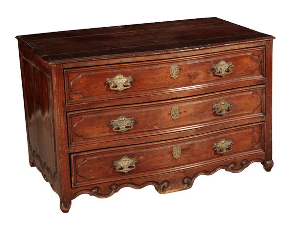 A FRENCH WALNUT SERPENTINE COMMODE