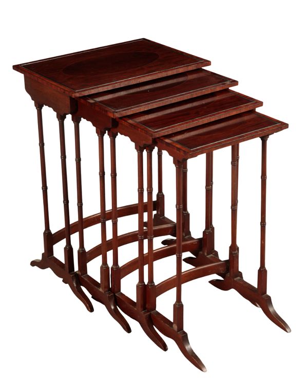 AN EDWARDIAN MAHOGANY NEST OF FOUR TABLES