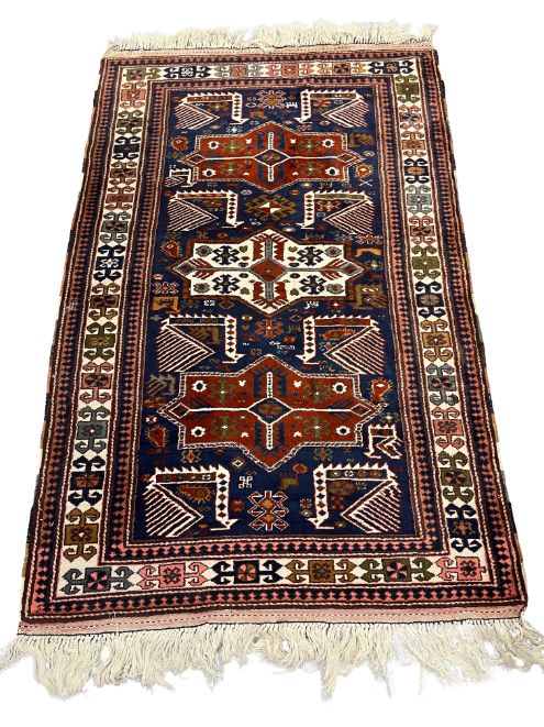 A CAUCASIAN WOOL RUG