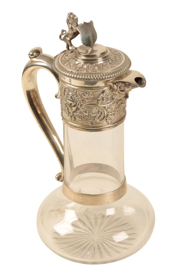 A SILVER MOUNTED CLARET JUG