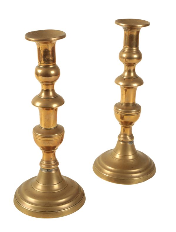 A PAIR OF BRASS CANDLESTICKS