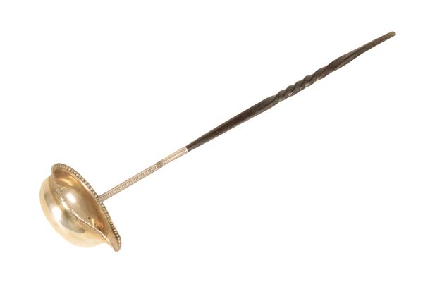 A WHITE METAL TODDY LADLE ENGRAVED