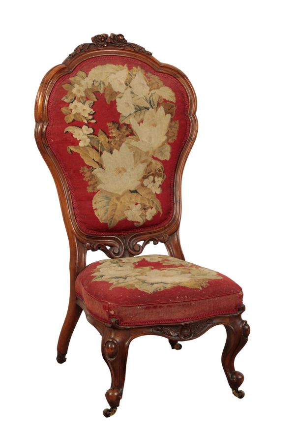 A VICTORIAN WALNUT NURSING CHAIR