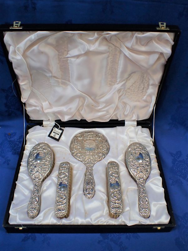 A SILVER-BACKED DRESSING TABLE SET