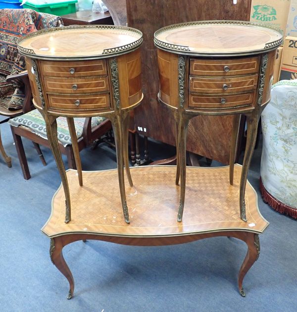 A PAIR OF LOUIS XVI STYLE OVAL BEDSIDE TABLES, WITH BRASS MOUNTS