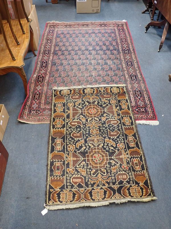 A BLUE-GROUND PERSIAN STYLE RUG