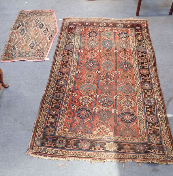 AN ANTIQUE BIJAR RUG